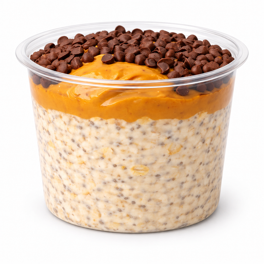 REESES PIECES OVERNIGHT OATS in a cup on a white background